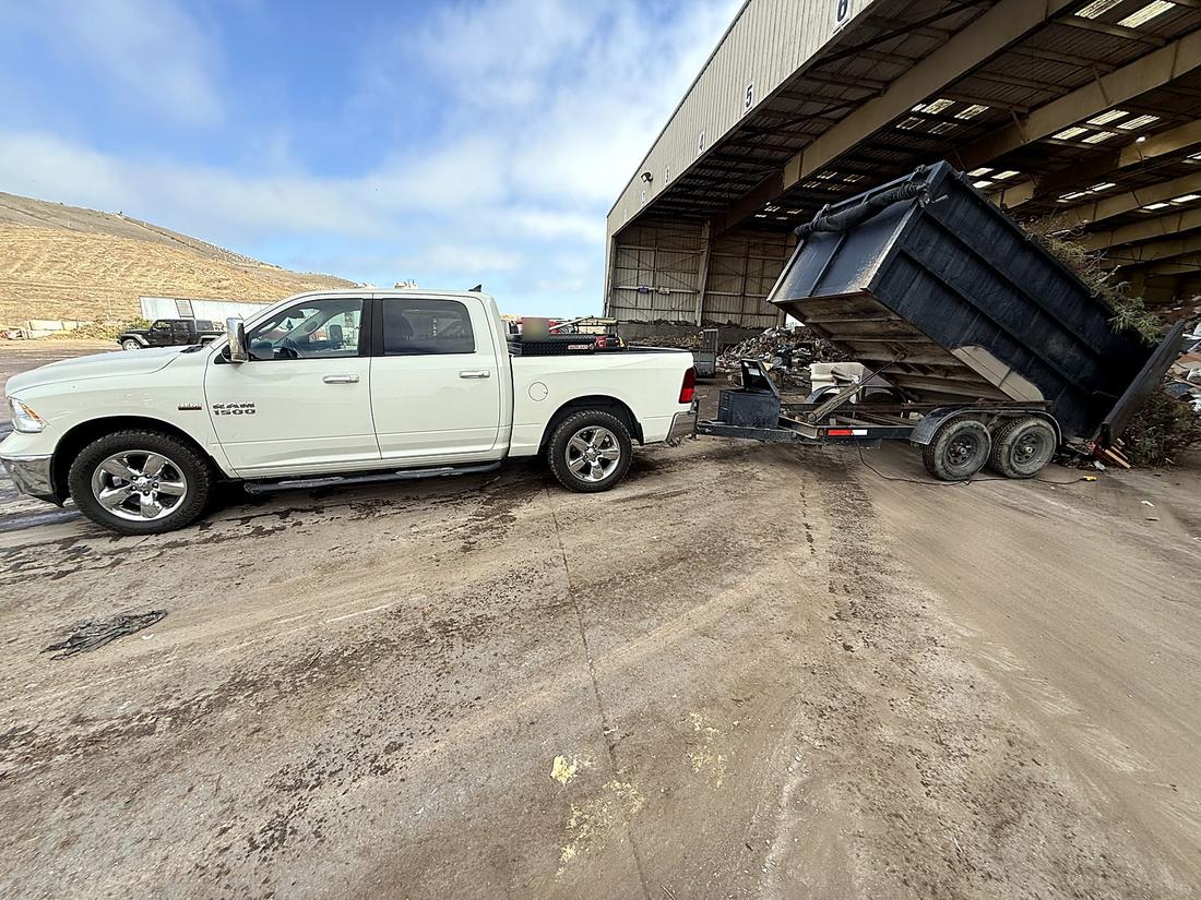 Unloading debris at a transfer station dump site
